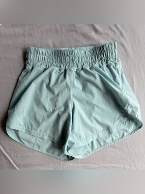 Lululemon track that shorts in teal color size 4